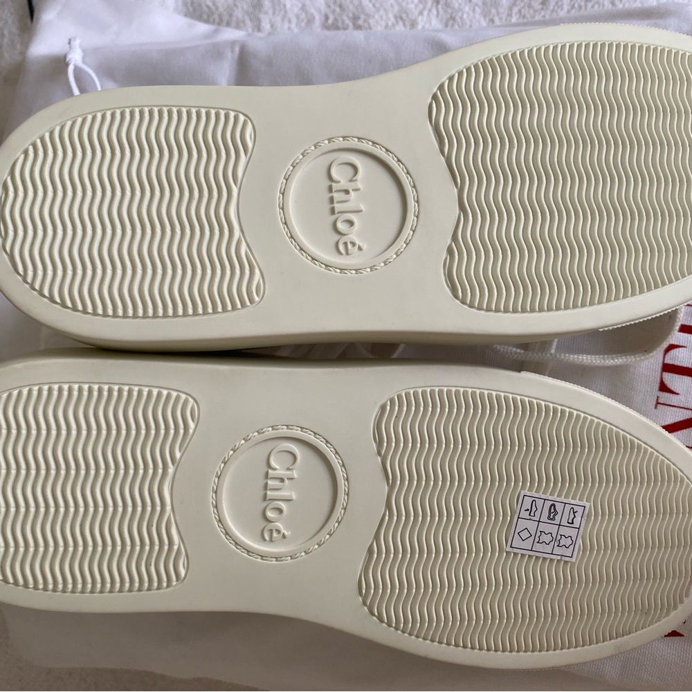 New White sneaks by Chloe Sz 37 with sliver leather at the back.
